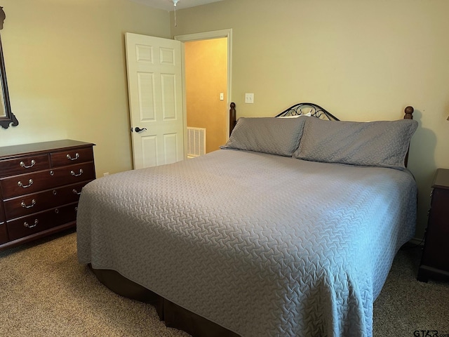 bedroom with visible vents and carpet flooring
