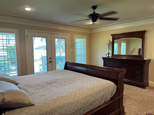 bedroom with crown molding, french doors, light colored carpet, and access to exterior