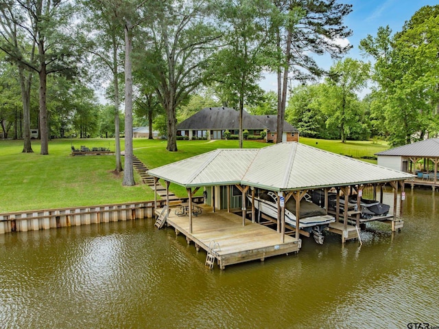 dock area featuring boat lift, a water view, and a yard