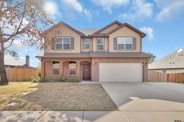 view of front facade featuring a garage and a front yard