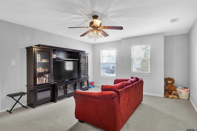 living room featuring light carpet and ceiling fan