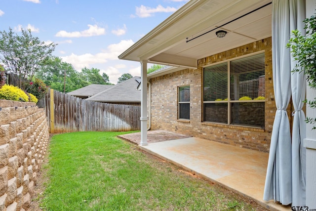 view of yard with a fenced backyard and a patio area