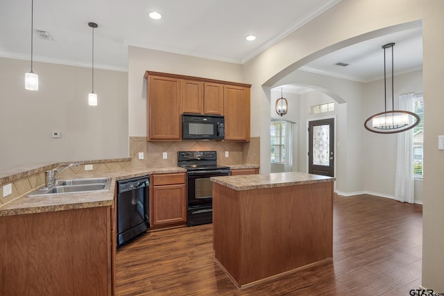 kitchen with visible vents, dark wood-style floors, a sink, and black appliances
