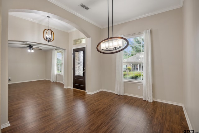 foyer featuring visible vents, baseboards, dark wood-style floors, arched walkways, and ceiling fan with notable chandelier