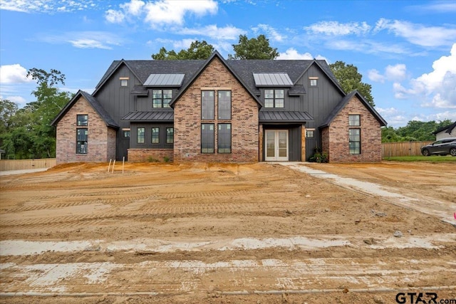 300 White-N-Gail Ln, Bullard, TX 75757 - modern farmhouse style home with a standing seam roof, board and batten siding, and metal roof