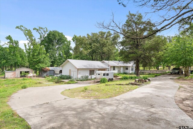 13386 Fm 858, Ben Wheeler, TX 75754 - view of front of house with concrete driveway and a front lawn