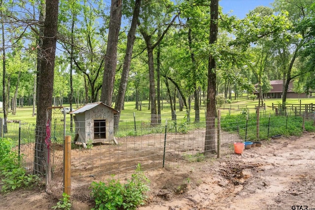 13386 Fm 858, Ben Wheeler, TX 75754 - view of yard with fence, an outdoor structure, and view of scattered trees