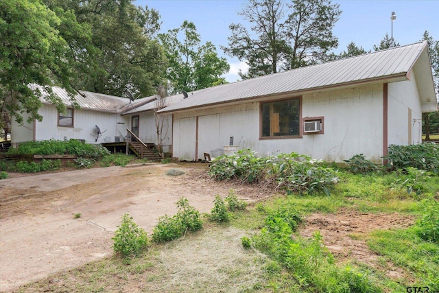 13386 Fm 858, Ben Wheeler, TX 75754 - ranch-style house featuring metal roof and a wall mounted air conditioner