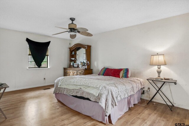 13386 Fm 858, Ben Wheeler, TX 75754 - bedroom featuring baseboards, wood finished floors, and a ceiling fan