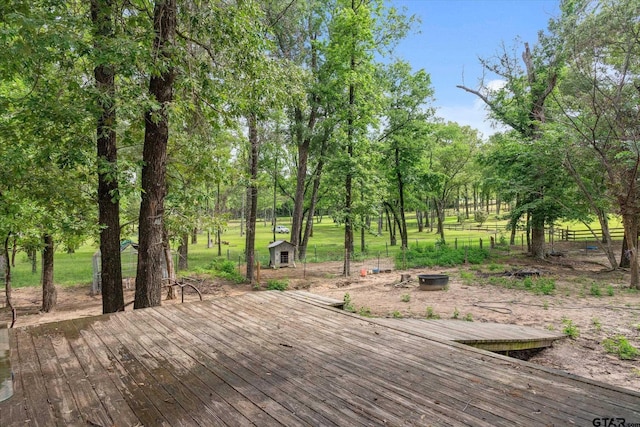 13386 Fm 858, Ben Wheeler, TX 75754 - deck featuring an outdoor structure, fence, a shed, and view of wooded area