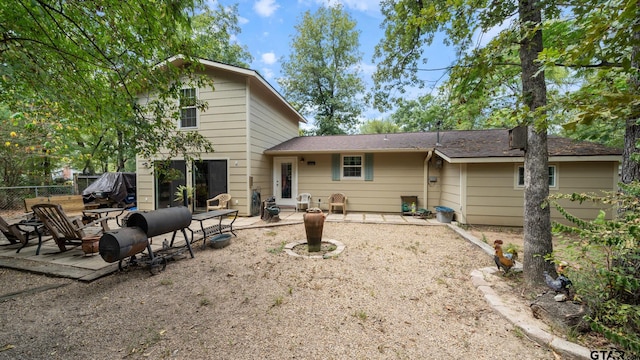 rear view of property with a patio area