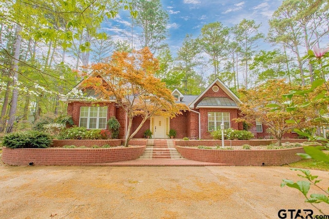 view of front facade featuring brick siding