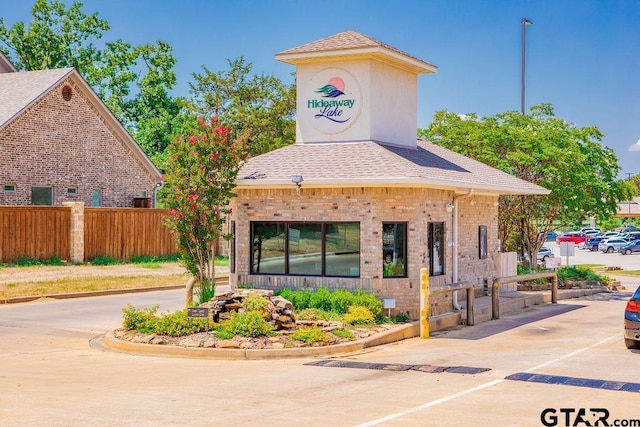 view of building exterior featuring fence