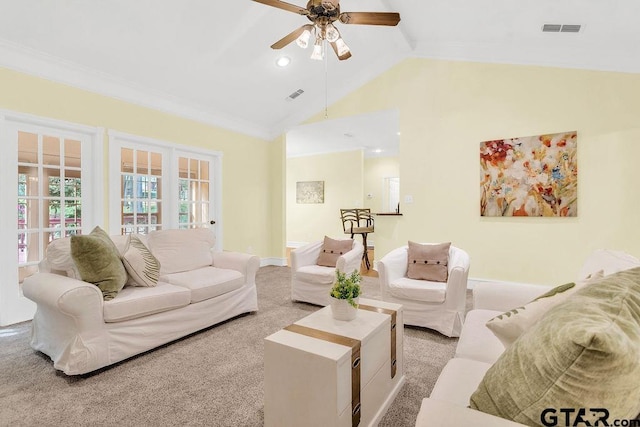 carpeted living area with baseboards, high vaulted ceiling, visible vents, and a ceiling fan