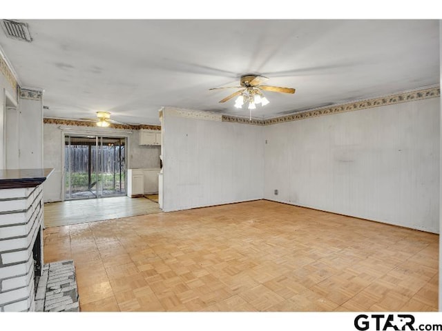 spare room featuring visible vents and a ceiling fan