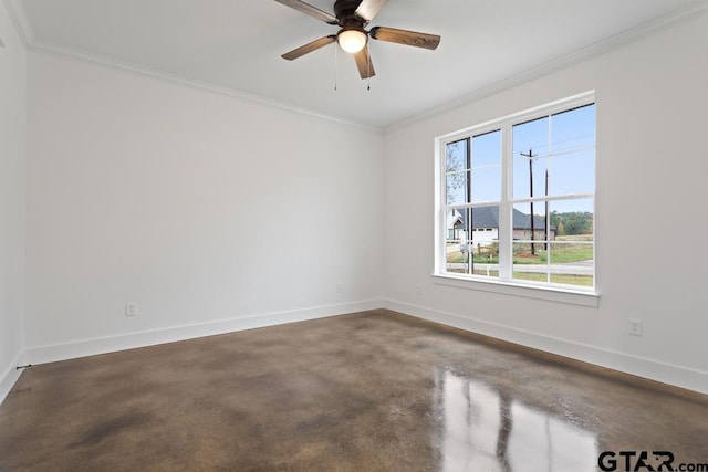 spare room with ceiling fan, concrete flooring, and ornamental molding