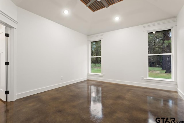 unfurnished room with vaulted ceiling