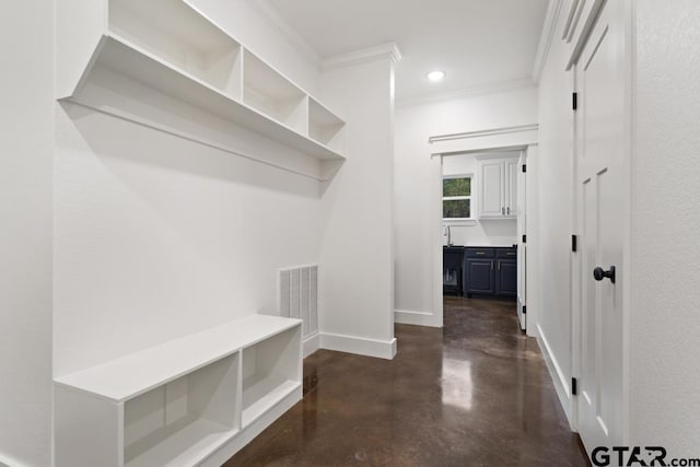 mudroom featuring ornamental molding