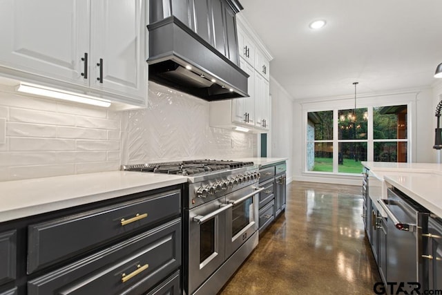 kitchen with pendant lighting, custom range hood, a notable chandelier, white cabinetry, and stainless steel appliances