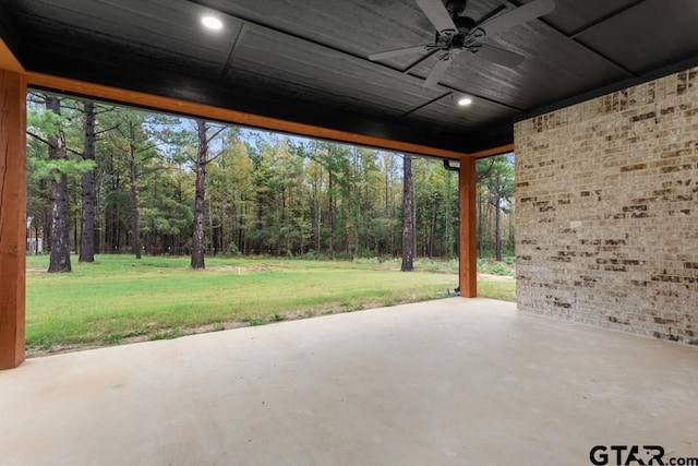 view of patio featuring ceiling fan