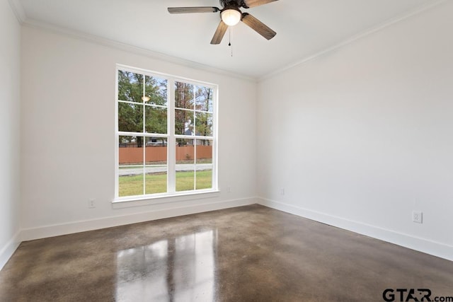 empty room featuring ceiling fan, concrete flooring, and ornamental molding