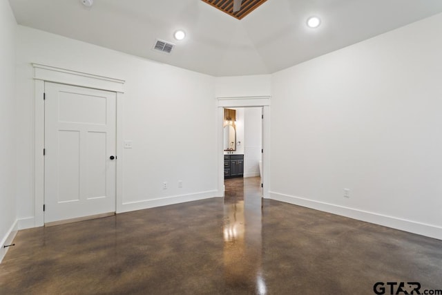 spare room with lofted ceiling