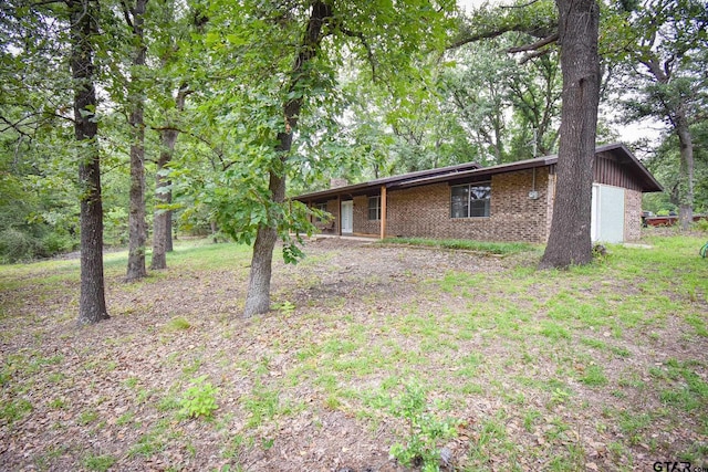 exterior space with brick siding