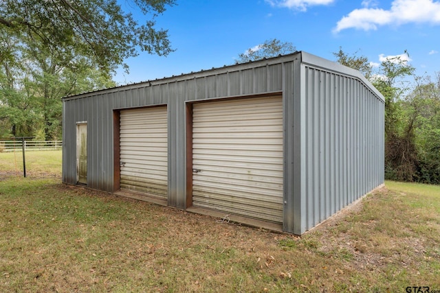 garage featuring a yard