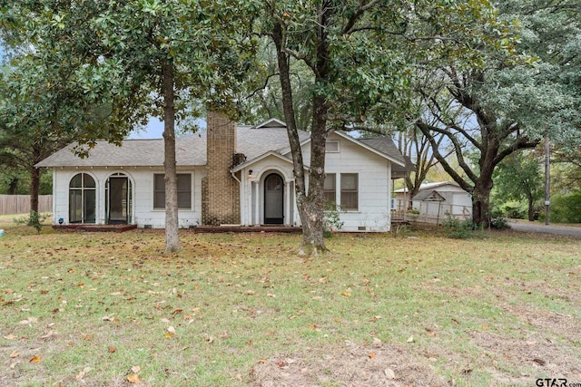 single story home featuring a front yard