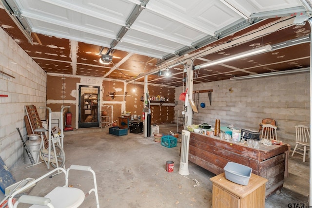 garage featuring a workshop area and a garage door opener