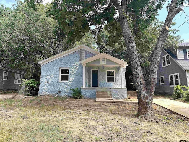 1409 W 3rd St, Tyler, TX 75701 - view of front of house with covered porch and stone siding