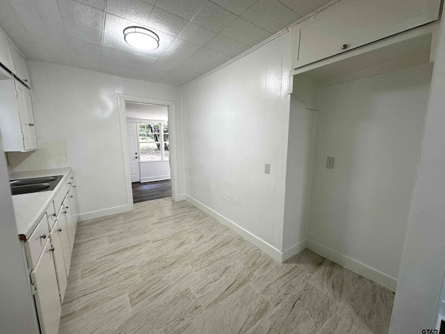 1409 W 3rd St, Tyler, TX 75701 - kitchen featuring light countertops and white cabinetry