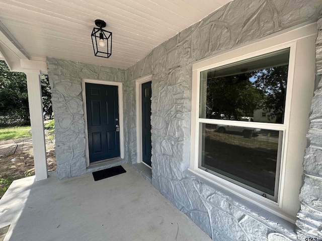 1409 W 3rd St, Tyler, TX 75701 - property entrance featuring a porch and stone siding