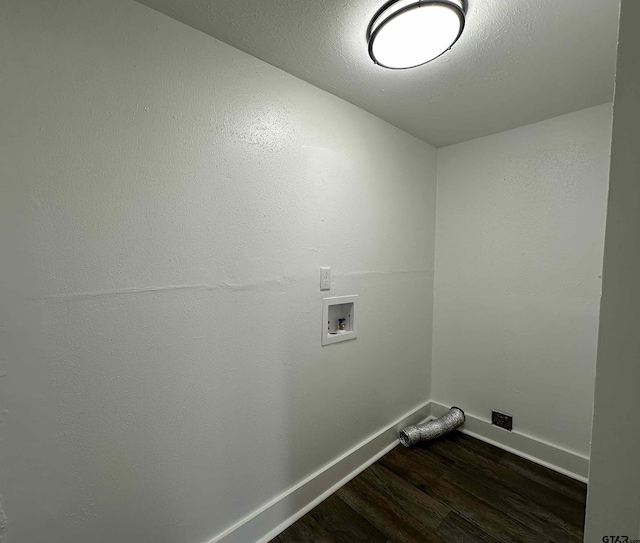 1409 W 3rd St, Tyler, TX 75701 - washroom with dark wood-style flooring and hookup for a washing machine