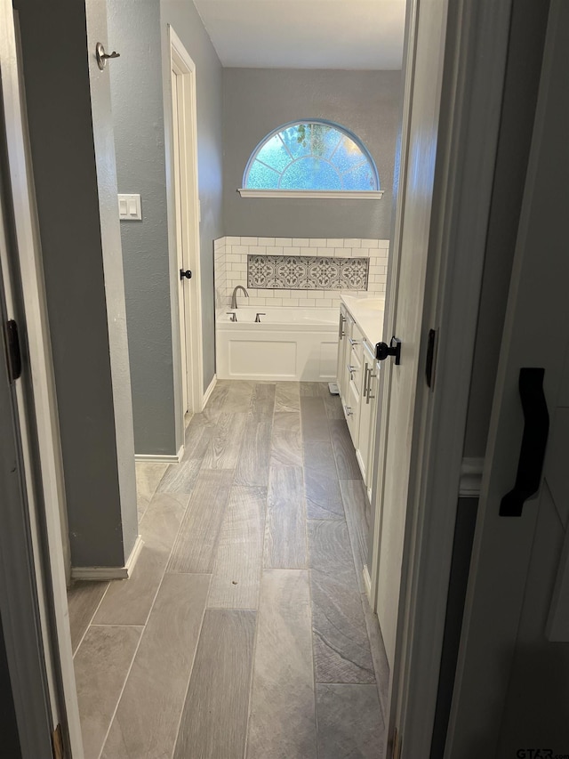 10845 Nashville Dr, Flint, TX 75762 - full bathroom with baseboards, tasteful backsplash, and a bath