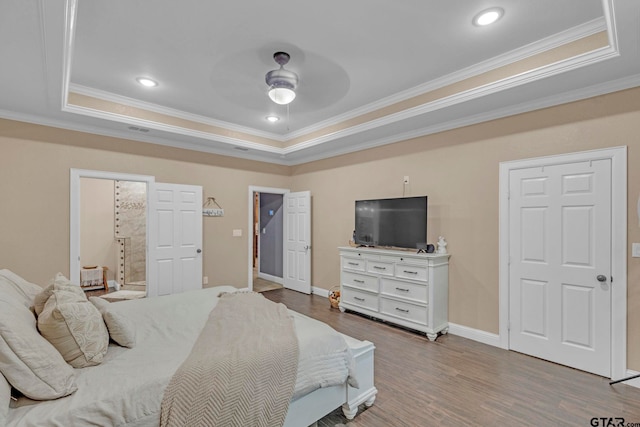 10708 C R 494, Tyler, TX 75706 - bedroom with a tray ceiling, ornamental molding, wood finished floors, ensuite bath, and recessed lighting