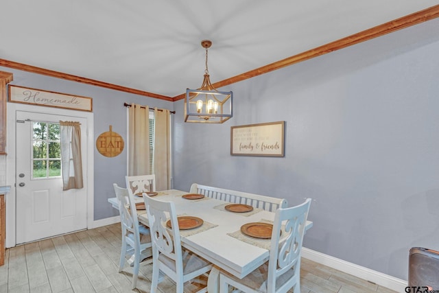10708 C R 494, Tyler, TX 75706 - dining space featuring a chandelier, light wood-style floors, and crown molding
