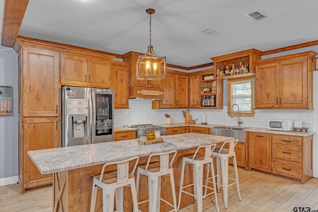 10708 C R 494, Tyler, TX 75706 - kitchen with appliances with stainless steel finishes, decorative backsplash, light wood-style floors, and open shelves