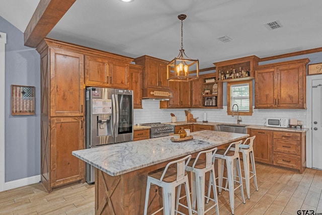 10708 C R 494, Tyler, TX 75706 - kitchen with premium range hood, light wood-type flooring, appliances with stainless steel finishes, and backsplash