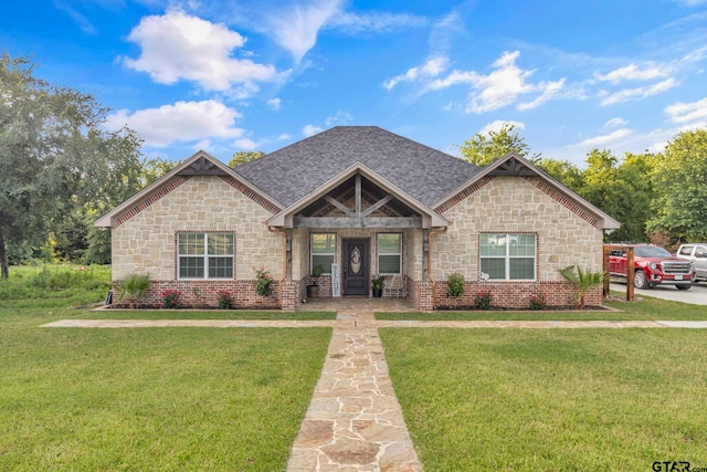 10708 C R 494, Tyler, TX 75706 - craftsman-style home with stone siding, a front yard, and roof with shingles