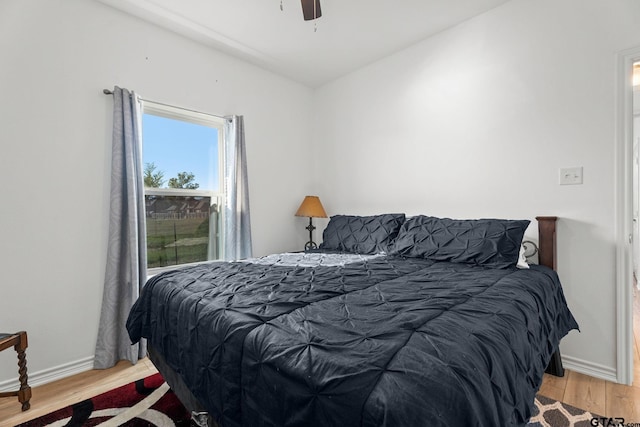 bedroom featuring ceiling fan and light hardwood / wood-style floors