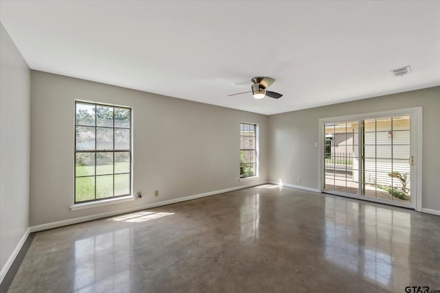 unfurnished room featuring concrete flooring and ceiling fan