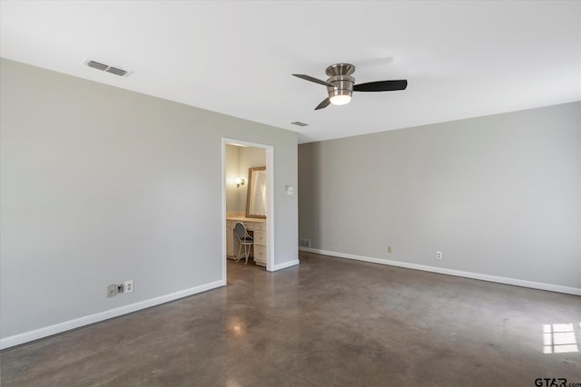 interior space featuring built in desk and ceiling fan