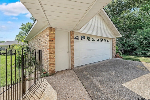 view of home's exterior with a garage and a yard