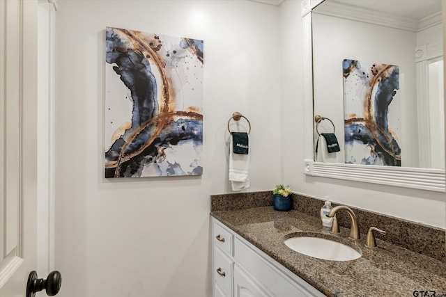 bathroom featuring vanity and ornamental molding