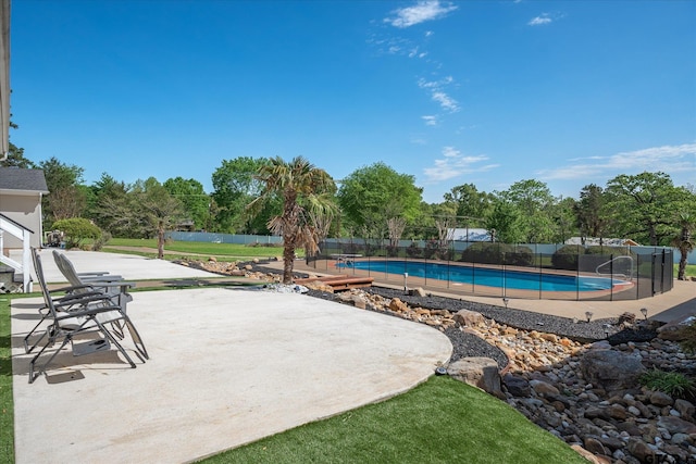 view of swimming pool featuring a patio area