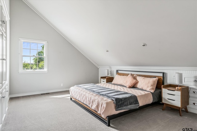 carpeted bedroom featuring lofted ceiling