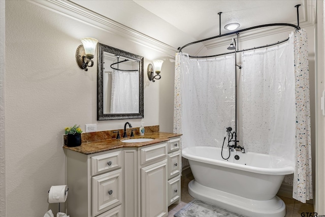 bathroom featuring ornamental molding and vanity