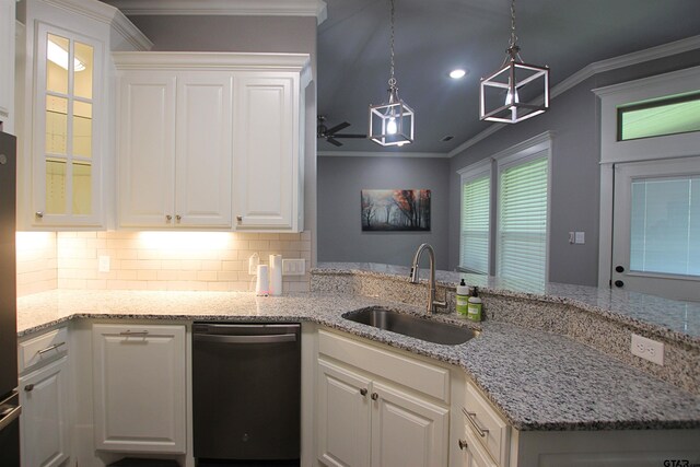 1700 Easy St, Tyler, TX 75703 - kitchen with dishwashing machine, crown molding, backsplash, white cabinets, and light stone countertops