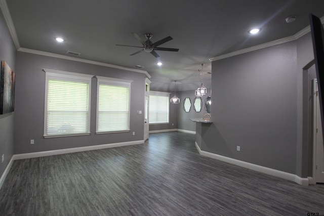 1700 Easy St, Tyler, TX 75703 - unfurnished living room featuring ceiling fan, crown molding, dark wood-style floors, and recessed lighting